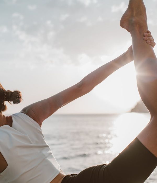 Woman in a calm yoga pose, embodying physical harmony and balance.